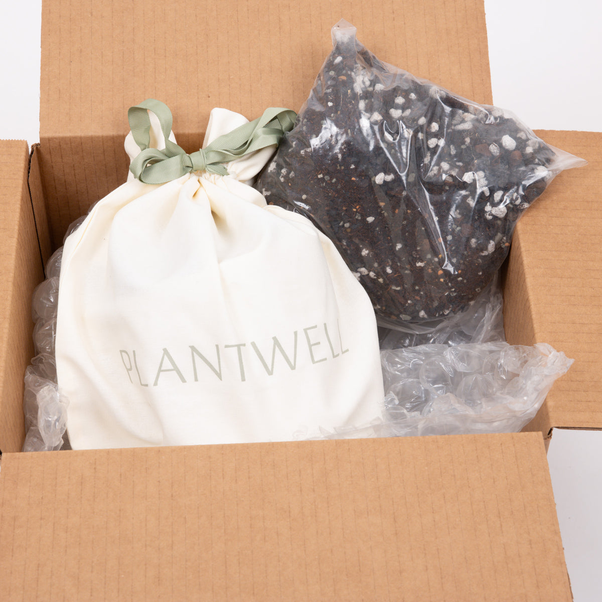 What's in the box: planter, insert, water-level gauge and Grava substrate